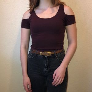 Dark purple top with shoulder cutouts.